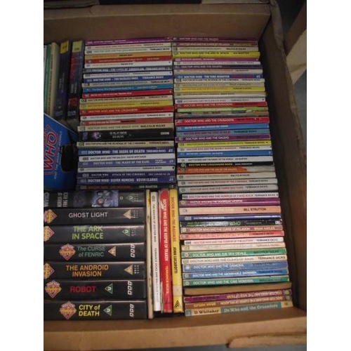 302 - 4 boxes of Doctor Who books. jigsaws, magazines etc.,