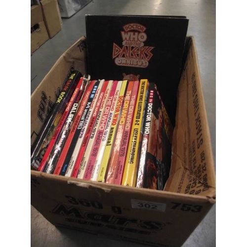 302 - 4 boxes of Doctor Who books. jigsaws, magazines etc.,