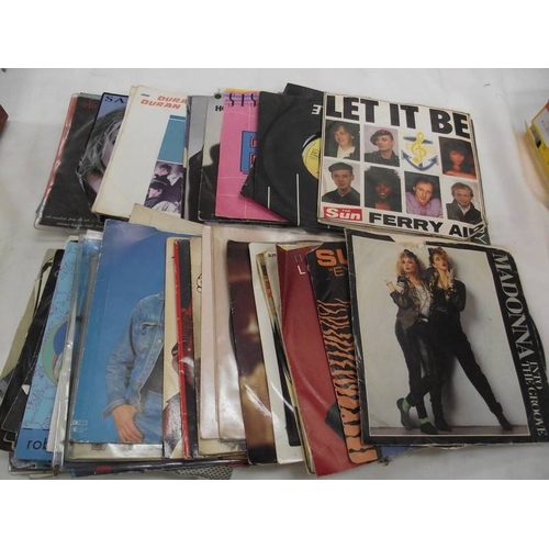 307 - A mixed lot of LP and 45 rpm records including Michael Jackson, Madonna etc.,