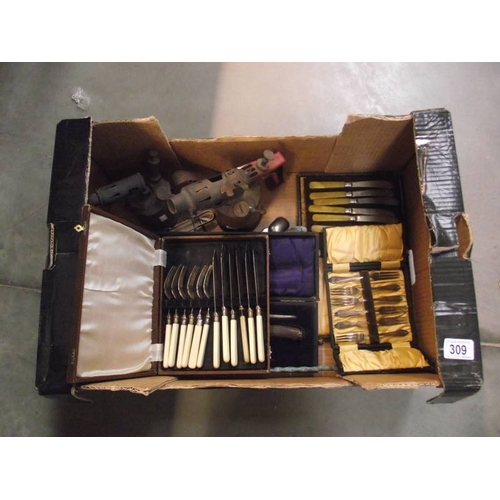 309 - A mixed lot of cased cutlery, brass blow lamps etc.,