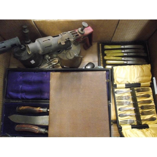 309 - A mixed lot of cased cutlery, brass blow lamps etc.,