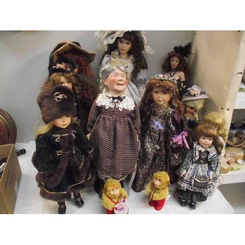 313 - A good selection of porcelain headed collector's dolls.