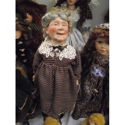 313 - A good selection of porcelain headed collector's dolls.