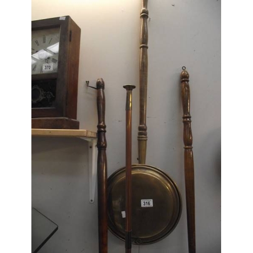 316 - 6 brass and copper bed warming pans and a copper post horn.