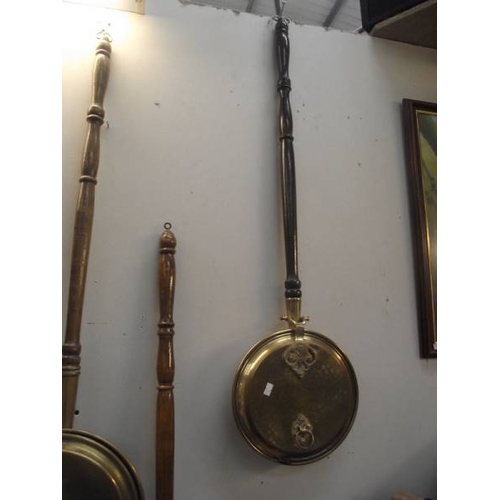 316 - 6 brass and copper bed warming pans and a copper post horn.