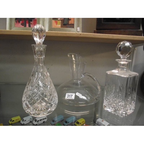 317 - 3 Decanters including Edinburgh crystal.