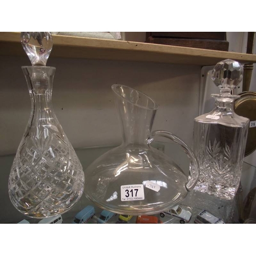 317 - 3 Decanters including Edinburgh crystal.