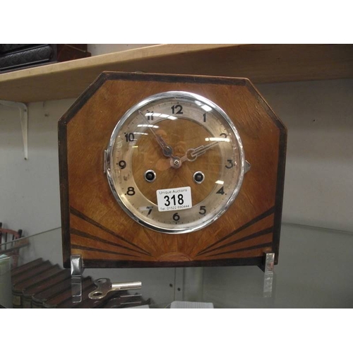 318 - An Art Deco mantel clock with key, in working order.