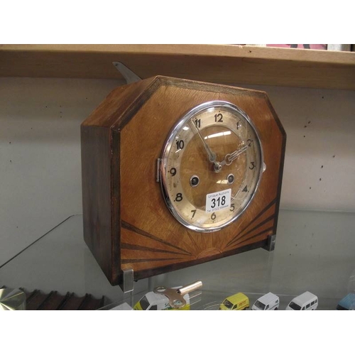 318 - An Art Deco mantel clock with key, in working order.