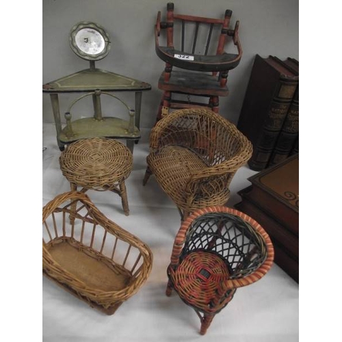 322 - A quantity of vintage wicker and wood doll's furniture.