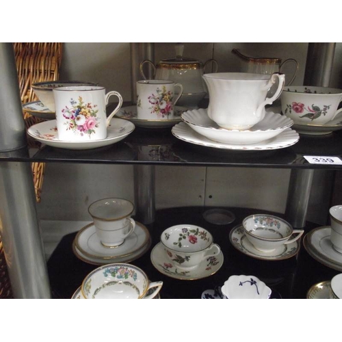 339 - A mixed lot of 19th and 20th century porcelain cups and saucers.