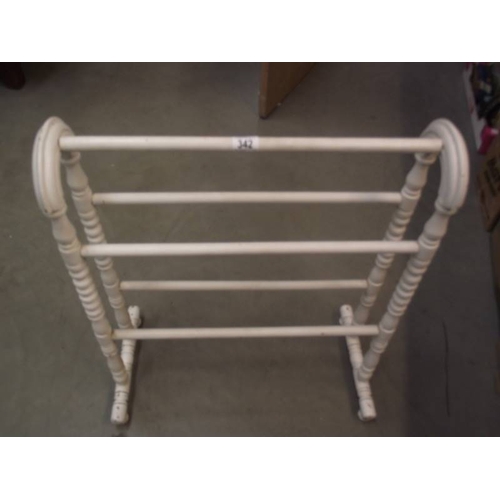 342 - A painted wooden towel rail.