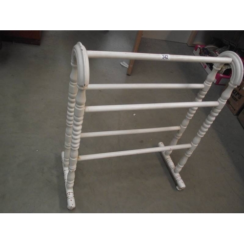 342 - A painted wooden towel rail.