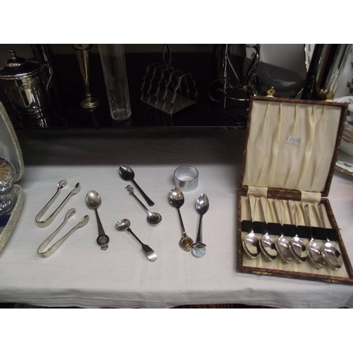 344 - 4 shelves of assorted chrome and silver plate including cutlery, tray, condiment sets etc.,