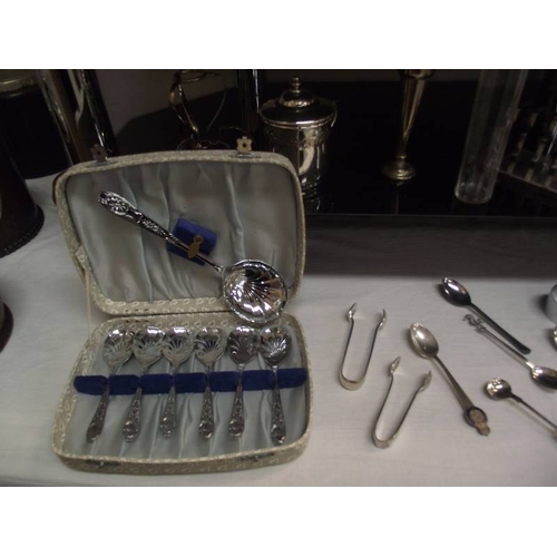 344 - 4 shelves of assorted chrome and silver plate including cutlery, tray, condiment sets etc.,