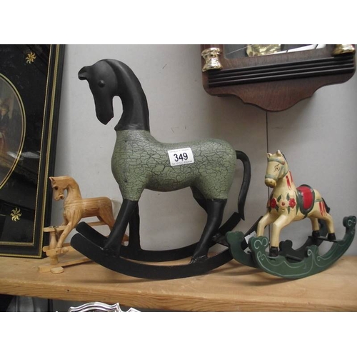 349 - 2 small wooden rocking horses, 1 ear a/f and a metal rocking horse