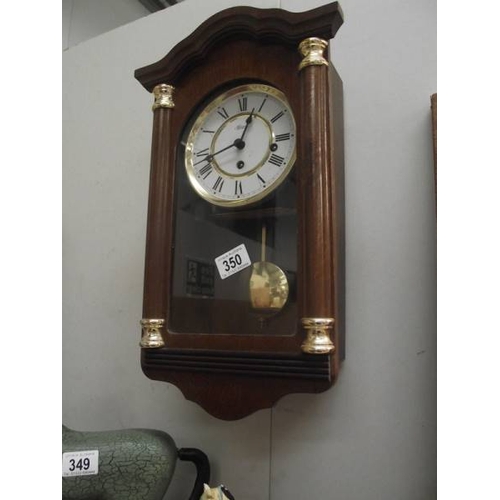 350 - A modern Hermle Westminster chime wall clock.