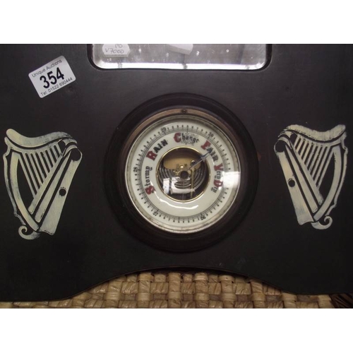 354 - A 1930/50's oak barometer with Guinness advertising.