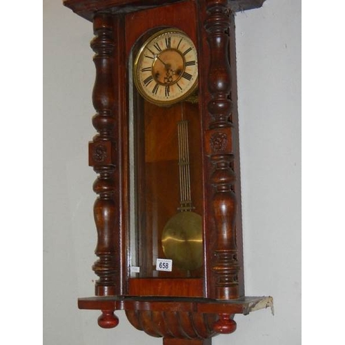 658 - A Victorian wall clock.