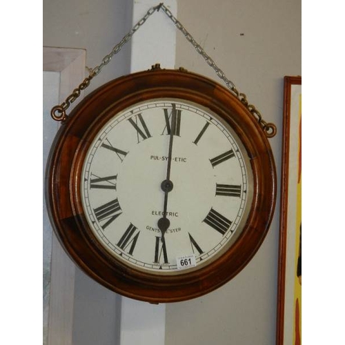 661 - A double faced electric railway clock, movement needs attention, i.e rewiring. Depth 15cm Diameter 4... 