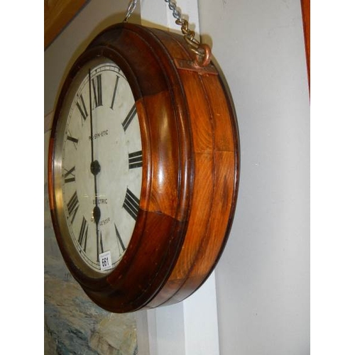 661 - A double faced electric railway clock, movement needs attention, i.e rewiring. Depth 15cm Diameter 4... 