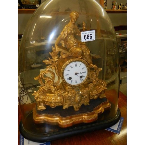 666 - A Spelter mantle clock under glass dome.