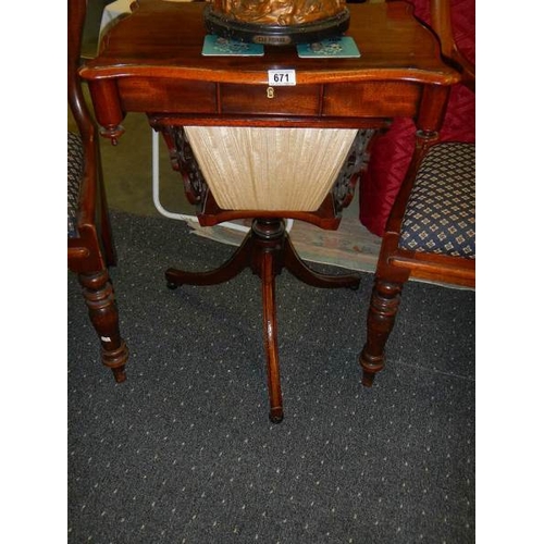 671 - A Victorian mahogany sewing table.