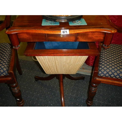 671 - A Victorian mahogany sewing table.