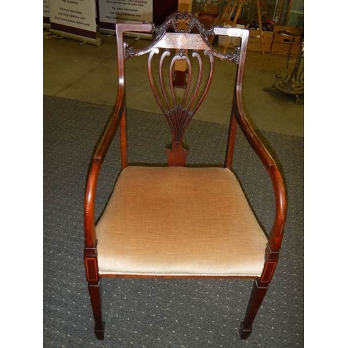 673 - An Edwardian inlaid elbow chair.