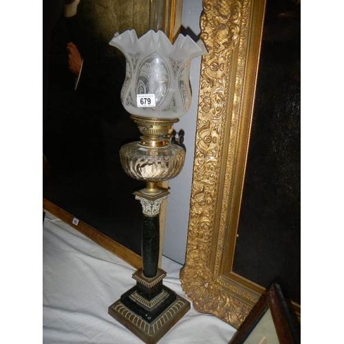 679 - A black marble Corinthian column oil lamp with cut glass font.