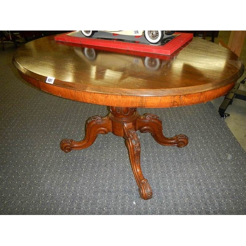 681 - A Victorian mahogany tip top dining table.