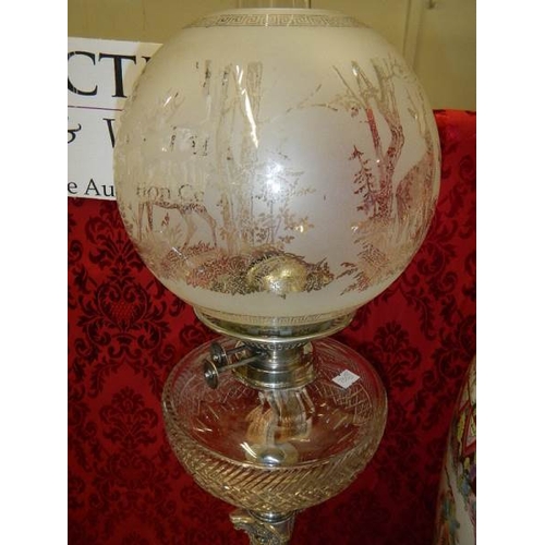 685 - A silver plated Elkington column oil lamp with cut glass font.