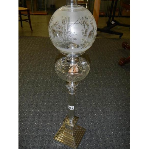 685 - A silver plated Elkington column oil lamp with cut glass font.