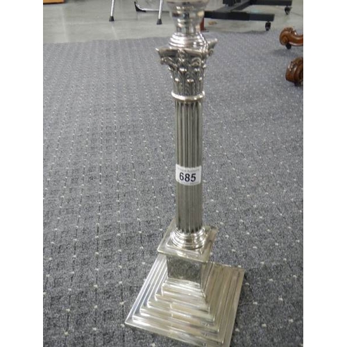 685 - A silver plated Elkington column oil lamp with cut glass font.