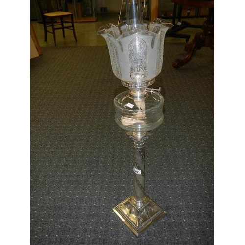 687 - A silver plated Corinthian column oil lam o with cut glass font and acid etched shade.