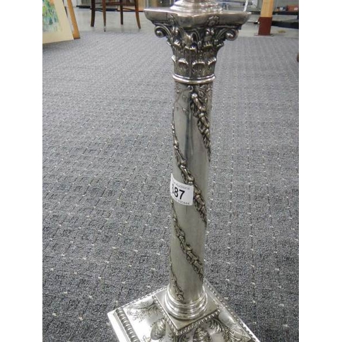 687 - A silver plated Corinthian column oil lam o with cut glass font and acid etched shade.