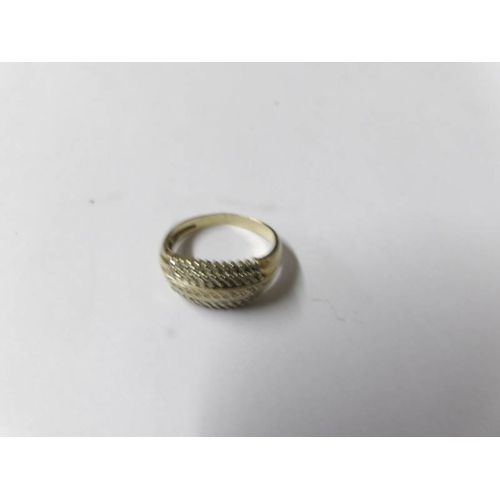 74 - A two tone gold and diamond ring, size Q.