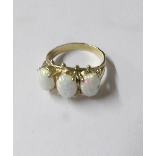 81 - A three stone 9ct gold opal ring, size Q half.