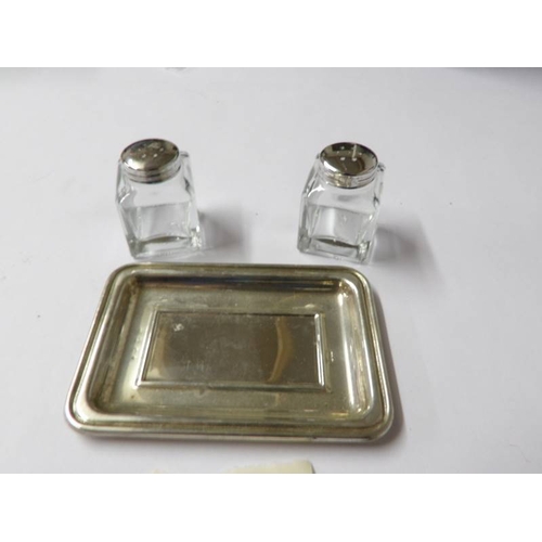 90 - A silver topped salt & pepper on silver tray.