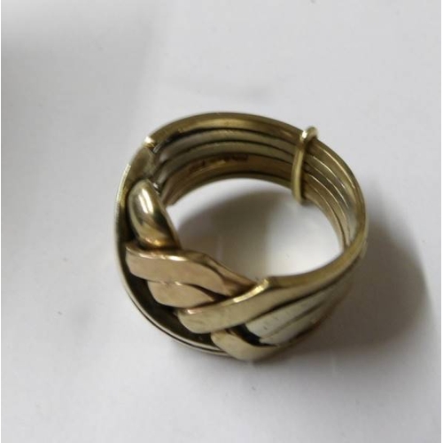 97 - A gent's gold puzzle ring, size R, approximately 12 grams.