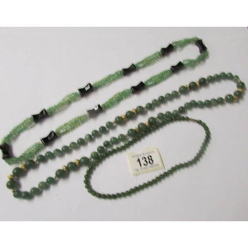 138 - 3 necklaces (possibly jade).