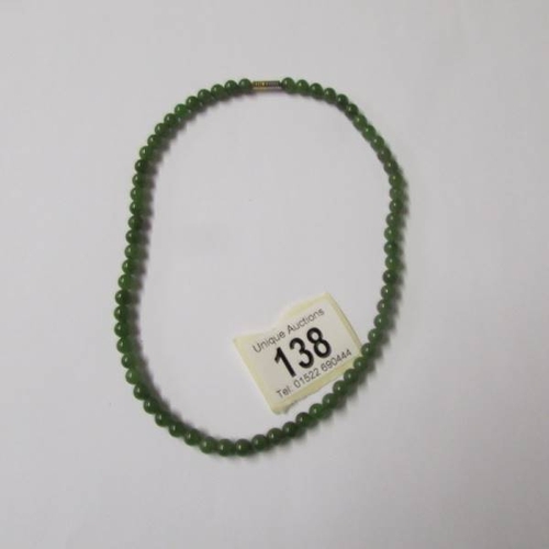 138 - 3 necklaces (possibly jade).