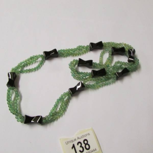 138 - 3 necklaces (possibly jade).