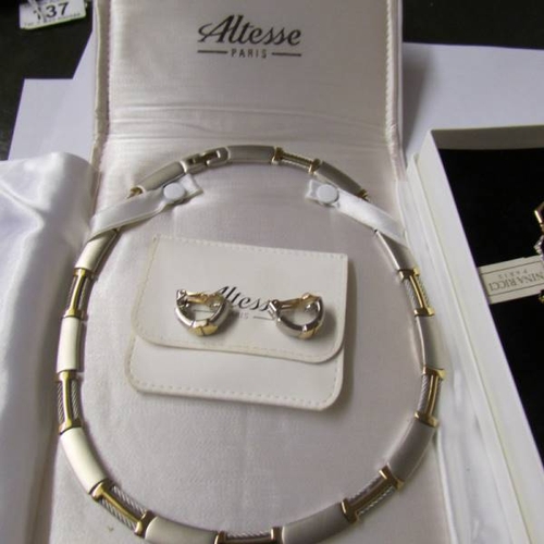 139 - An Altesse Paris necklace, bracelet and earrings together with a Nina Ricci necklace and earrings.