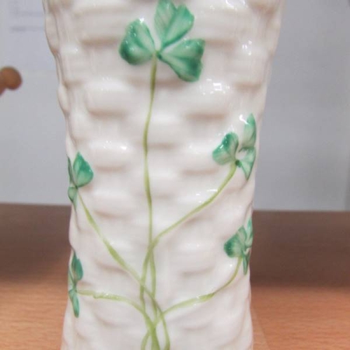 145 - A Belleek vase decorated with shamrocks, 14 cm tall.