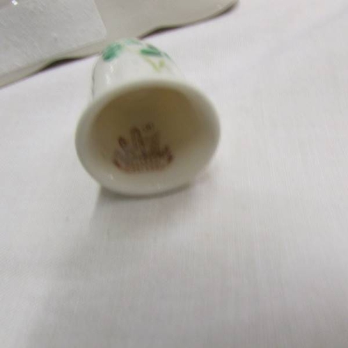 147 - A Belleek pin tray and thimble decorated with shamrocks.