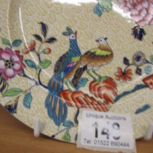 148 - A Spode hand painted plate decorated with birds.  20 cm diameter.