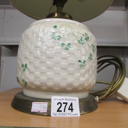 274 - A Belleek table lamp with shade.