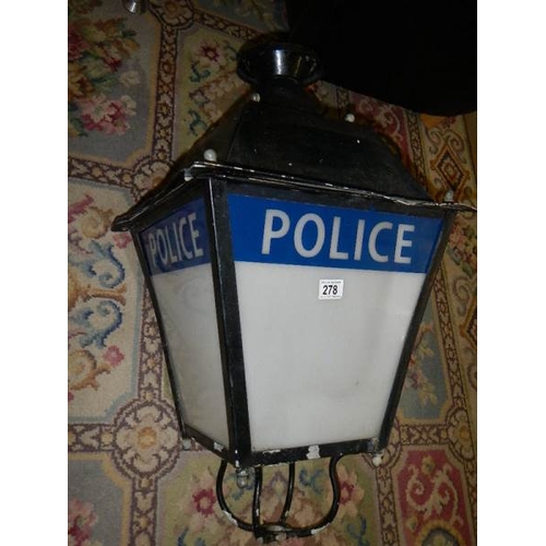 278 - An old street lamp with Police motif.