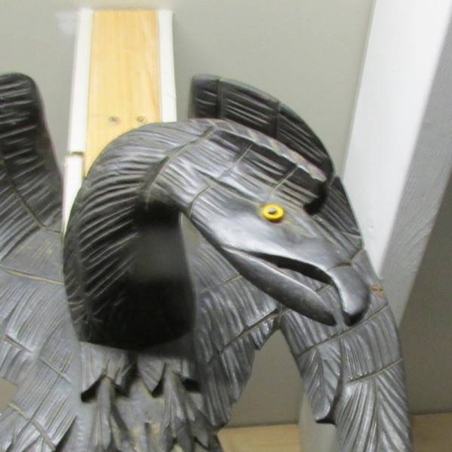 279 - A Black Forest carved wall/hall mirror surmounted 2 eagles with glass eyes. (155 cm / 61'' tall).